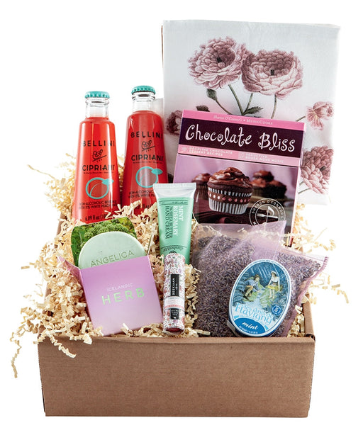 Take a Break Gift Box includes: Angelica soap from Iceland, a tin of French mints, Beekman lip balm, mint rosemary hand cream, lavender sachets, bottles of Cipriani Bellini, a kitchen towel, Chocolate Bliss with recipes and music