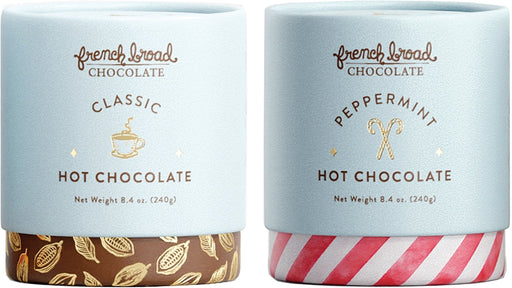 Two canisters of French Broad Hot Chocolate mix